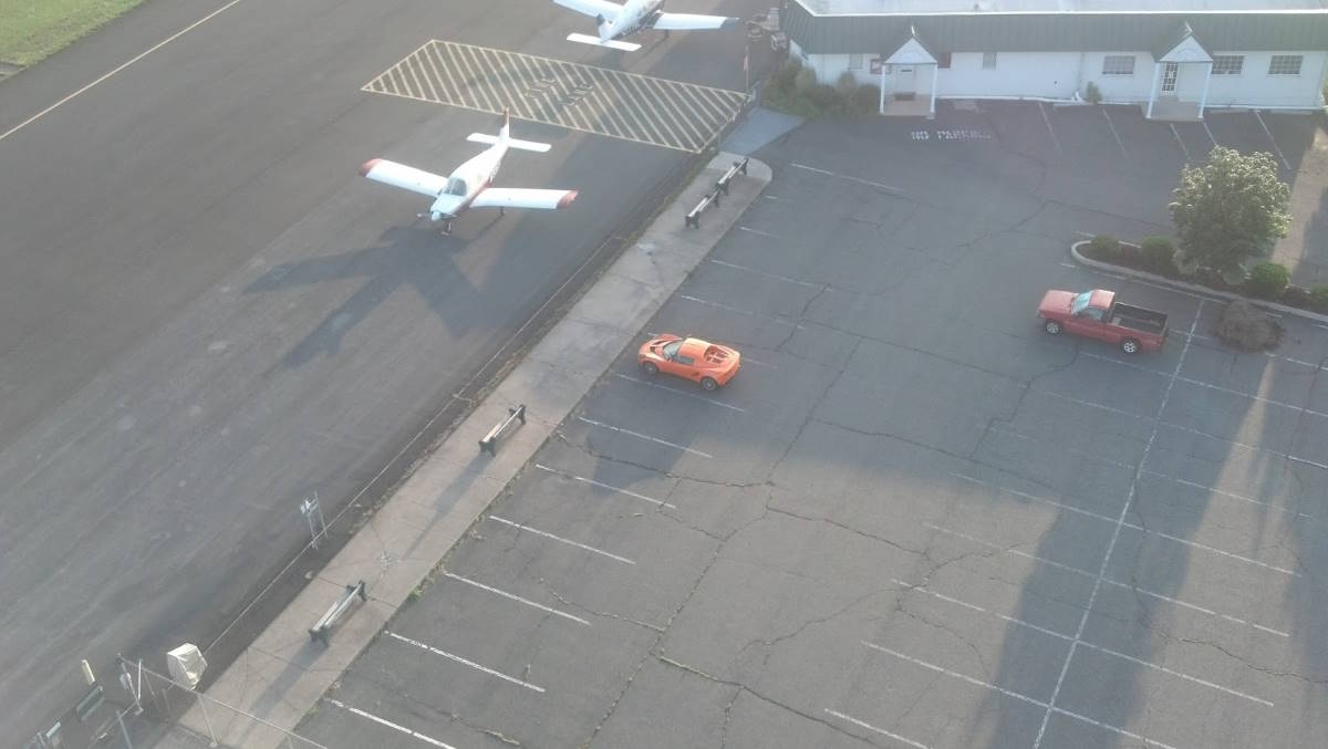 A view of my Lotus in the parking lot from the air while I was flying solo.